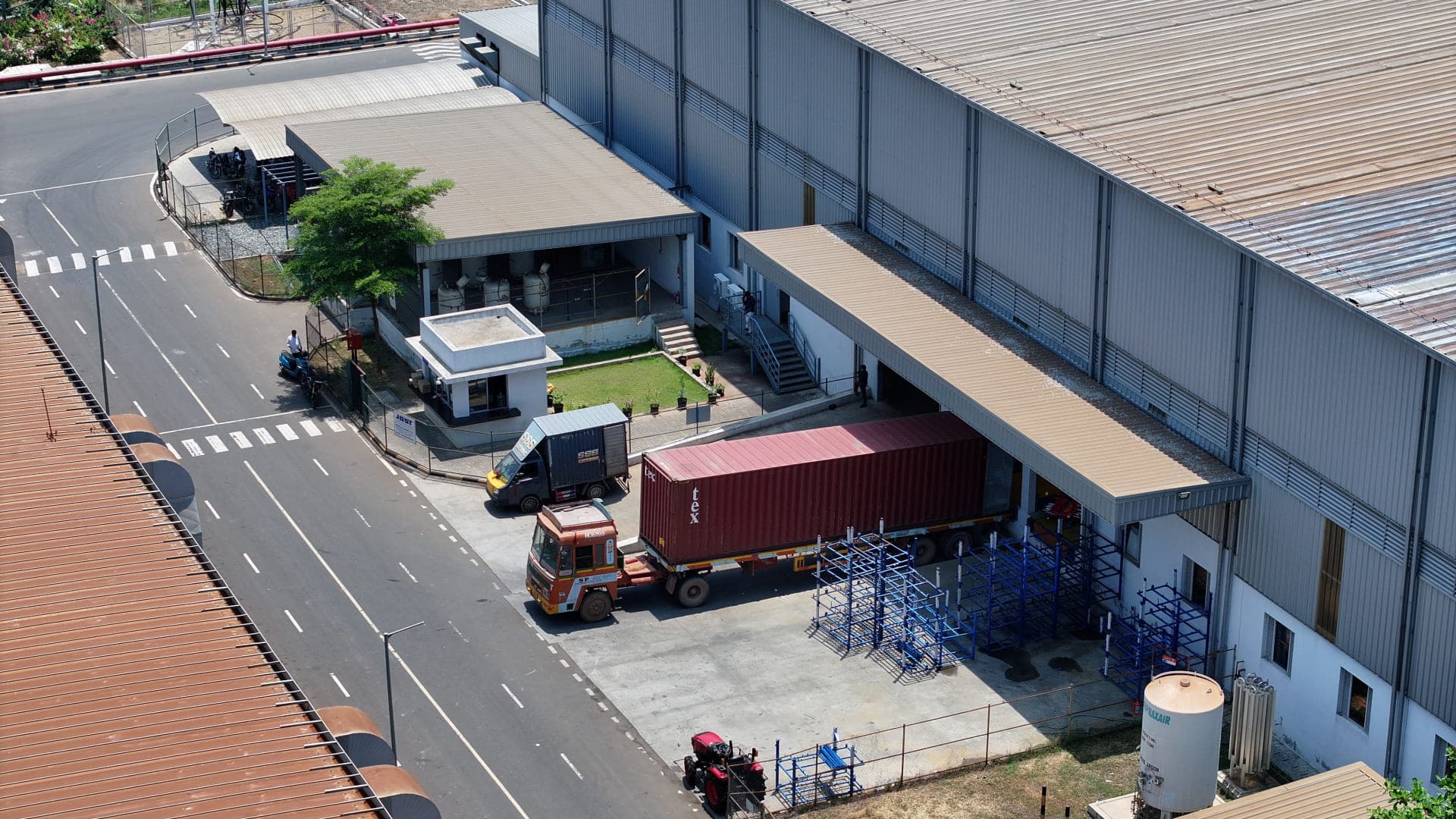 Aerial view of a Greenbase industrial facility with internal roads and loading operations