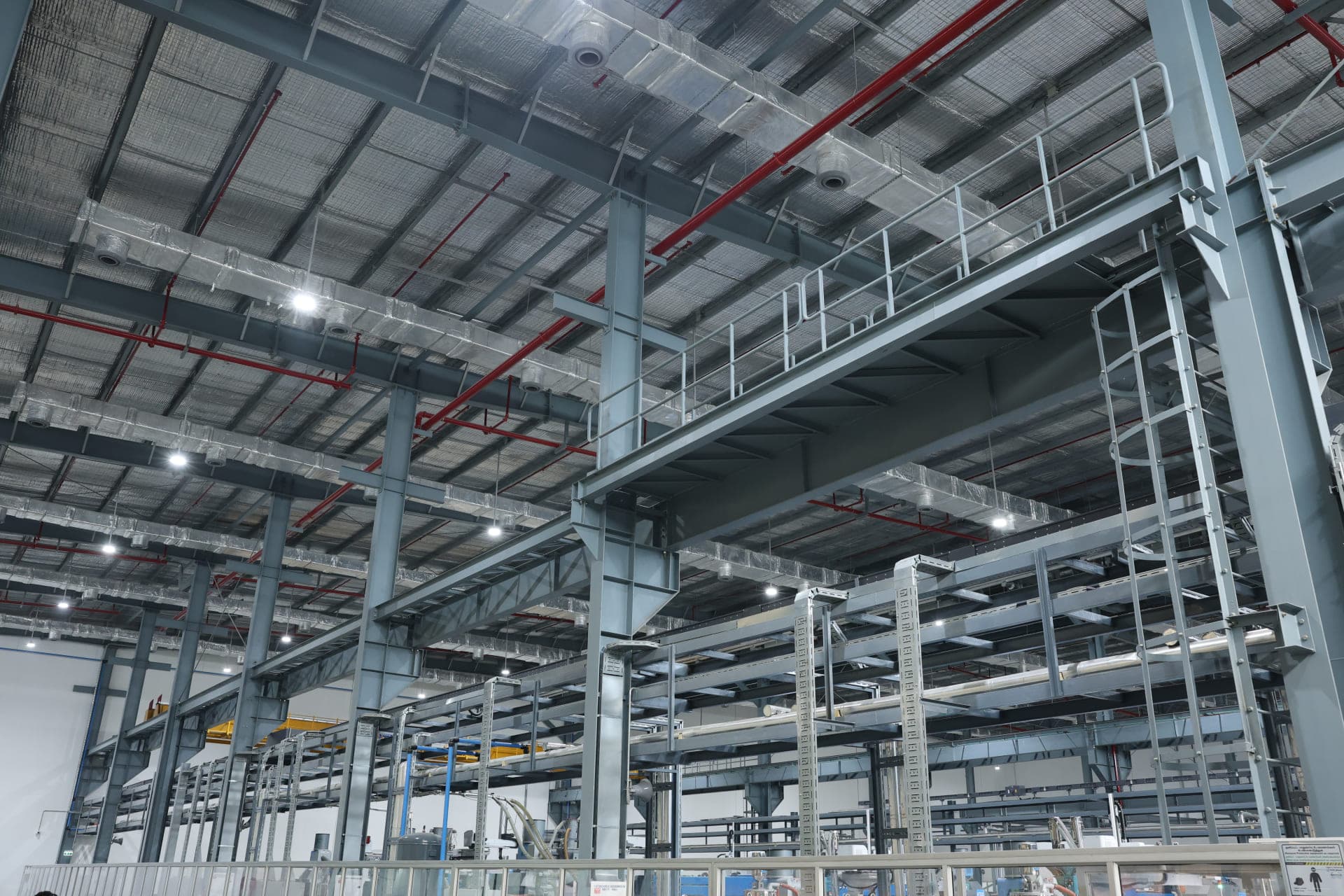 Interior of a Greenbase industrial facility showing integrated utilities and structural infrastructure