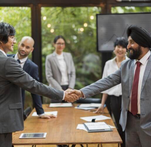 Business handshake representing client-first approach
